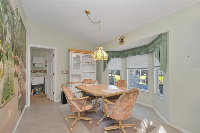 a dining room with furniture and window