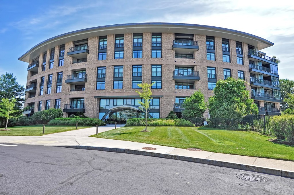 a view of a building with a yard