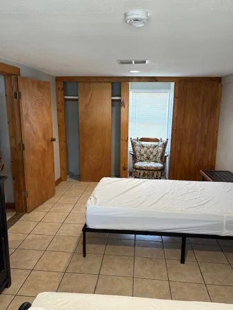 a view of a park that has large trees