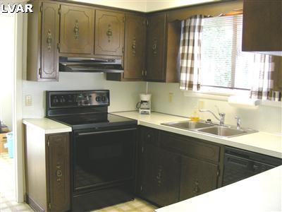 425 Georgetown Road Nazareth, PA 18064 - Photo 6 of 14 a kitchen with stainless steel appliances granite countertop a sink stove and refrigerator