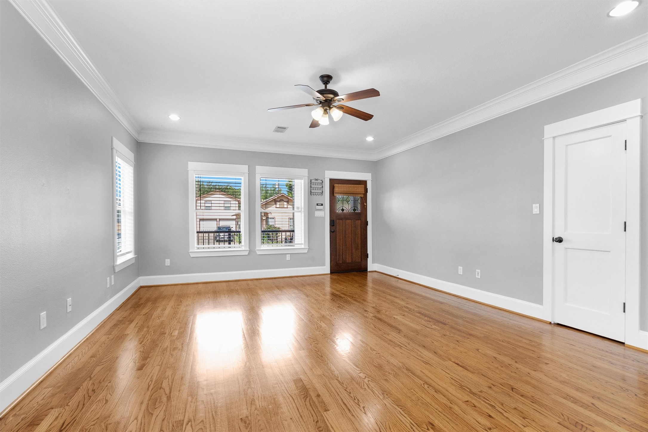 304 Vincent Street Houston, TX 77009 - Photo 7 of 36 wooden floor in an empty room with a window