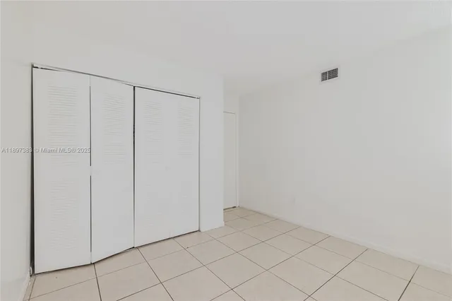 a view of an empty room with window