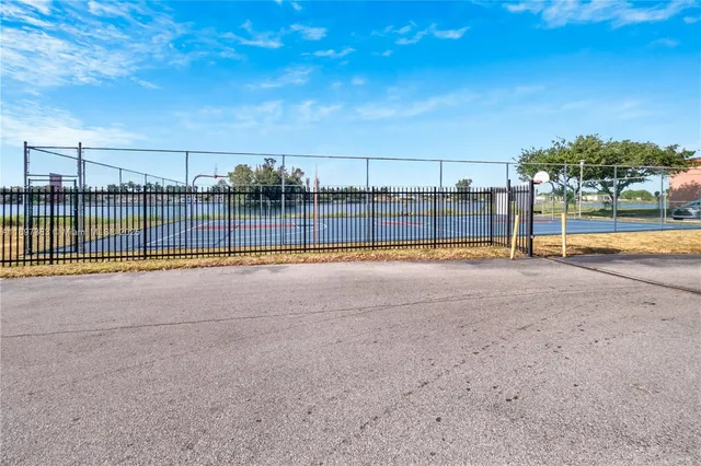 a view of a swimming pool with a yard