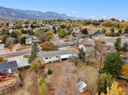 an aerial view of residential houses with outdoor space