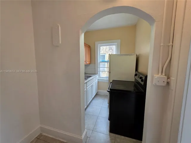 a kitchen with a sink appliances and cabinets
