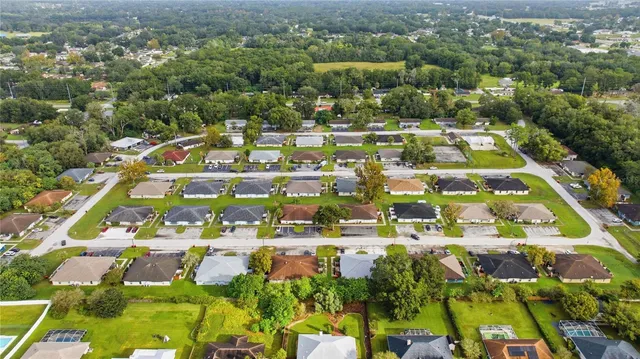 an aerial view of residential houses with outdoor space