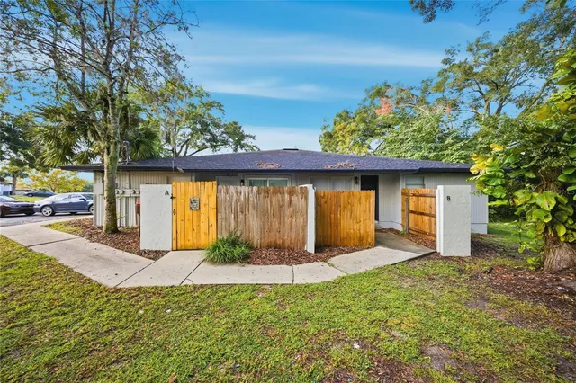 a view of a backyard with a garden and plants