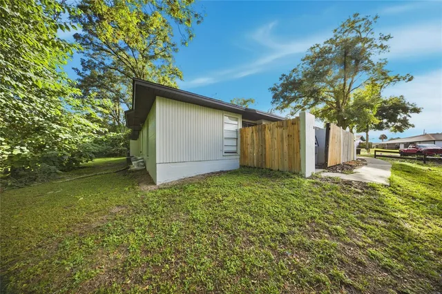 a backyard of a house with lots of green space