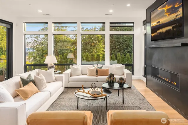 a living room with furniture and a large window