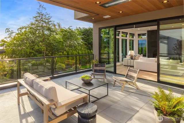 a view of a livingroom with furniture and hardwood floor