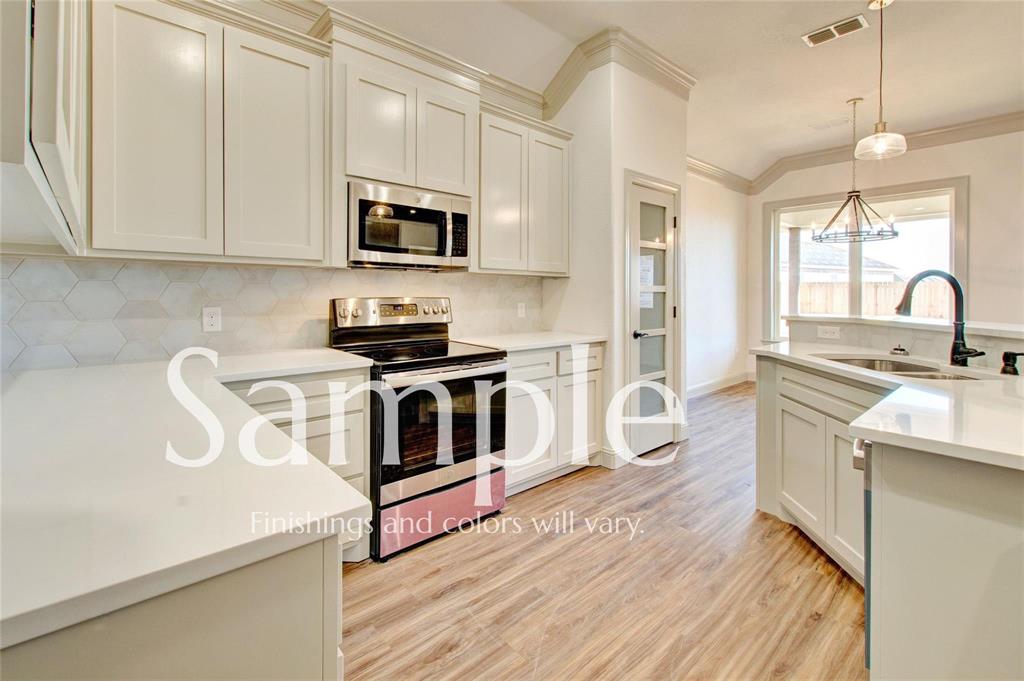 7648 Mountain View Road Abilene, TX 79602 - Photo 8 of 21 a kitchen with stainless steel appliances a white stove top oven a sink a counter space and cabinets