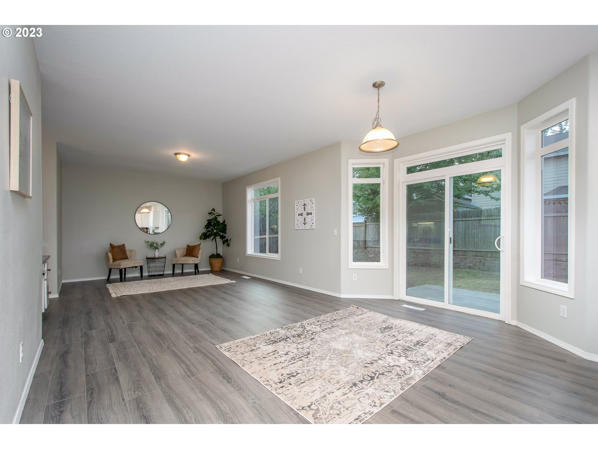 1830 North 8th Way Ridgefield, WA 98642 - Photo 14 of 44 a view of a livingroom with furniture window and wooden floor