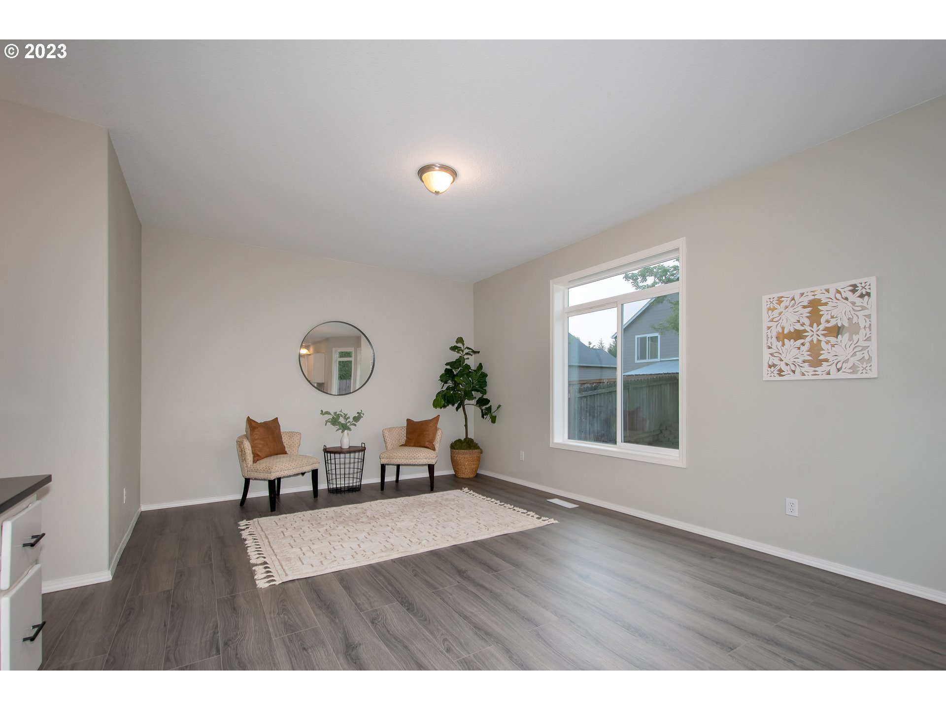 1830 North 8th Way Ridgefield, WA 98642 - Photo 17 of 44 a living room with furniture window and wooden floor