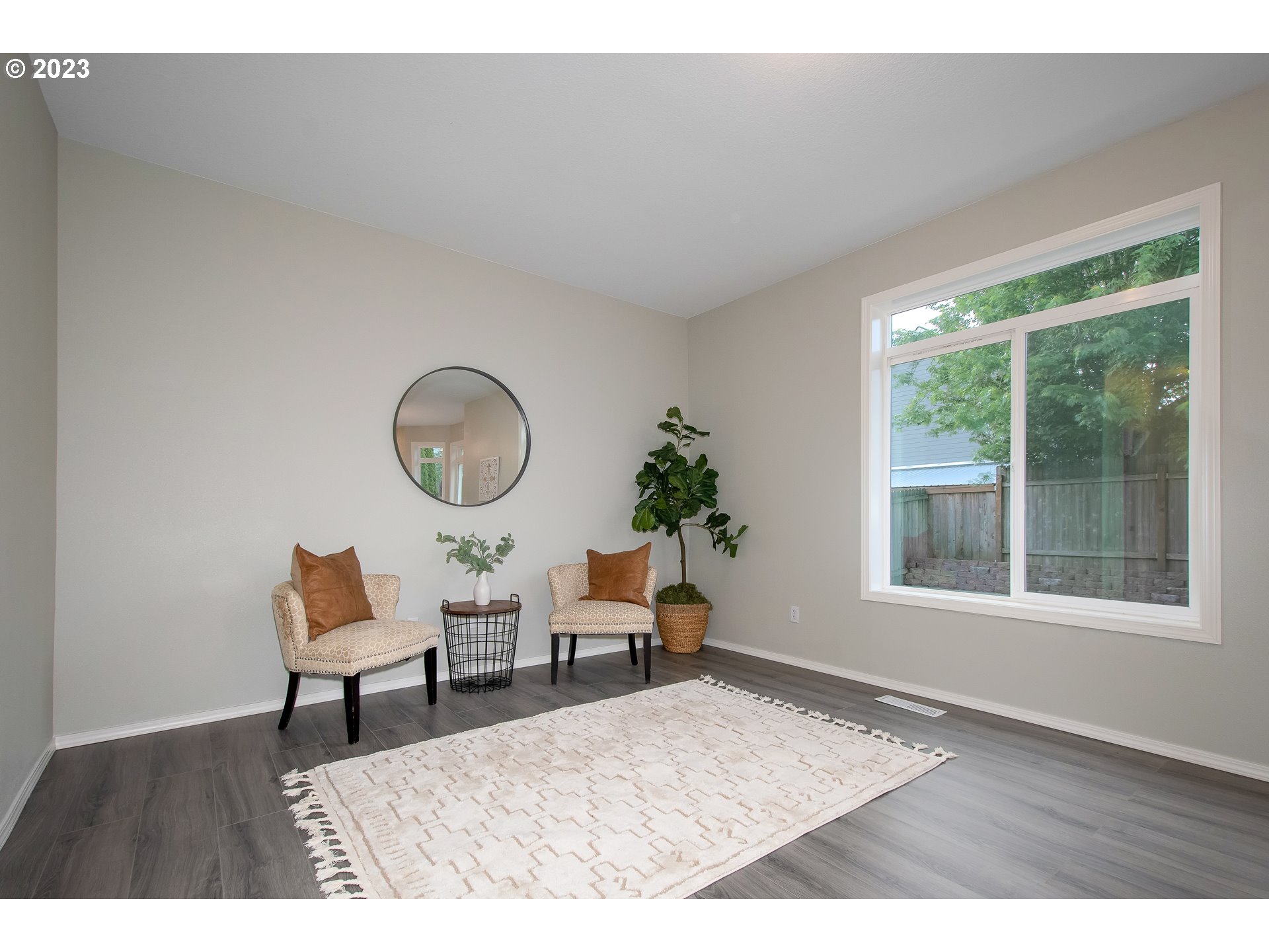 1830 North 8th Way Ridgefield, WA 98642 - Photo 18 of 44 a living room with furniture and a potted plant