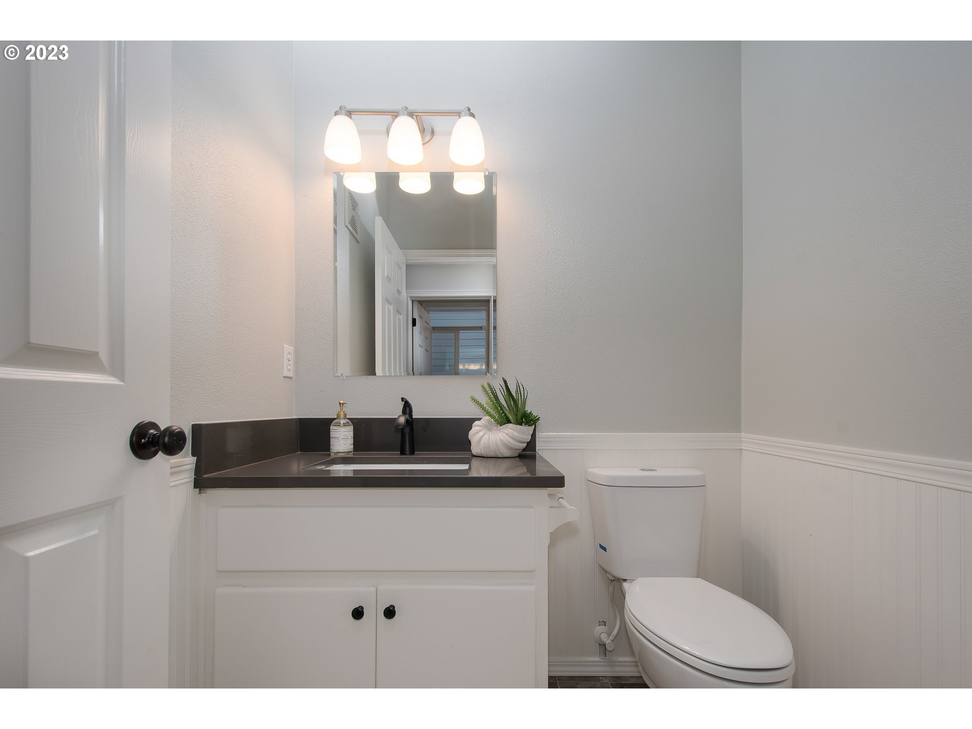 1830 North 8th Way Ridgefield, WA 98642 - Photo 20 of 44 a bathroom with a sink a toilet a mirror and vanity