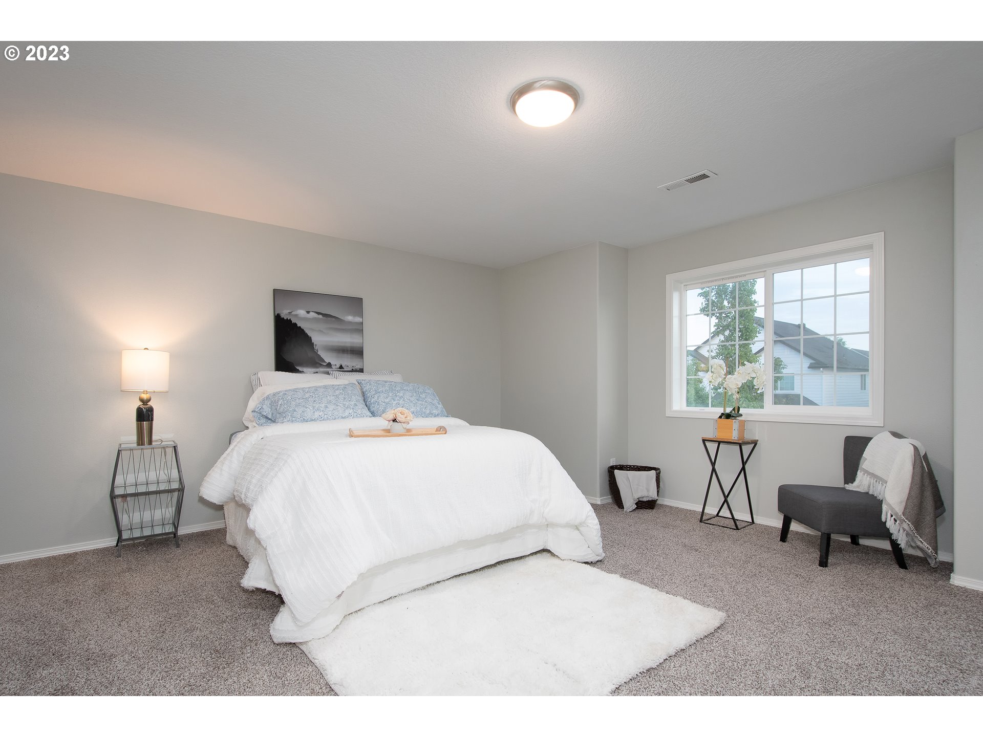 1830 North 8th Way Ridgefield, WA 98642 - Photo 25 of 44 a bed room with a bed and a chair