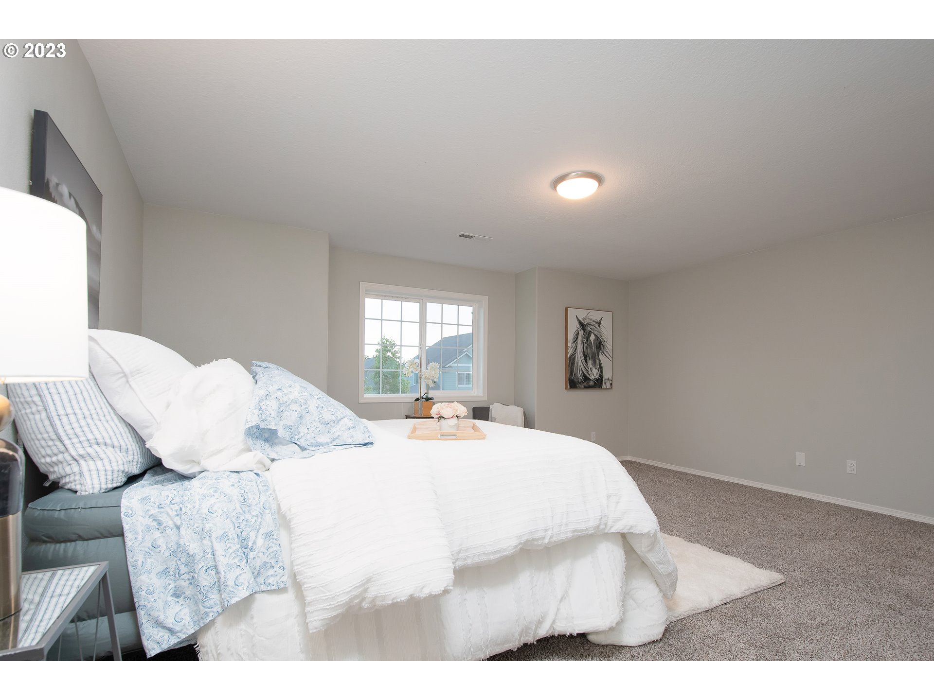 1830 North 8th Way Ridgefield, WA 98642 - Photo 26 of 44 a bedroom with a bed and a night stand