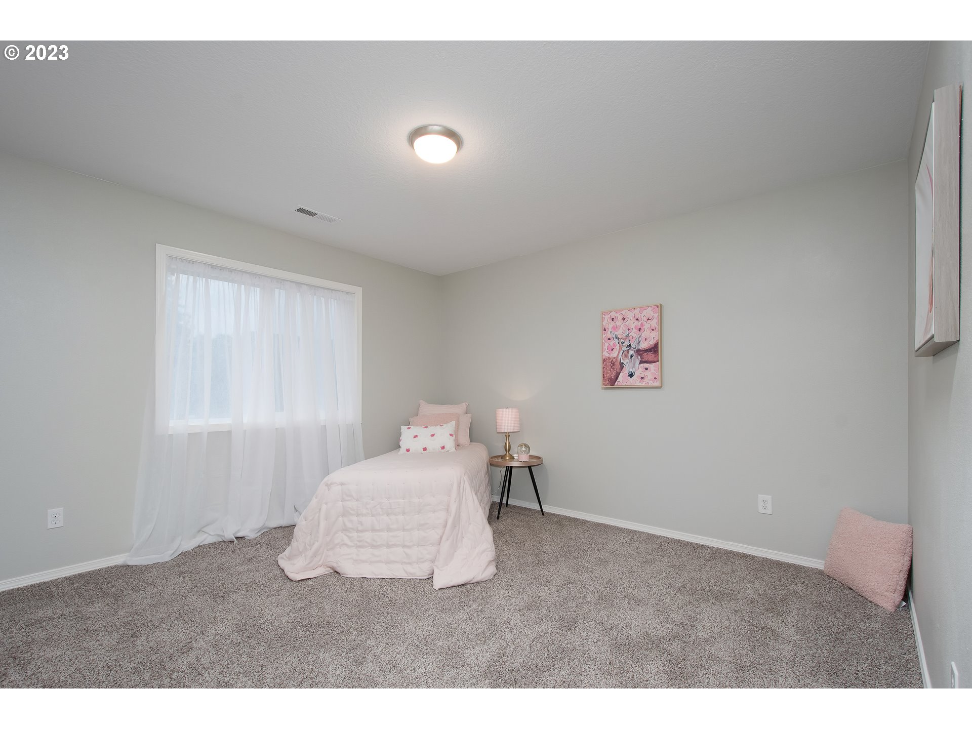 1830 North 8th Way Ridgefield, WA 98642 - Photo 29 of 44 a bedroom with a bed and a window