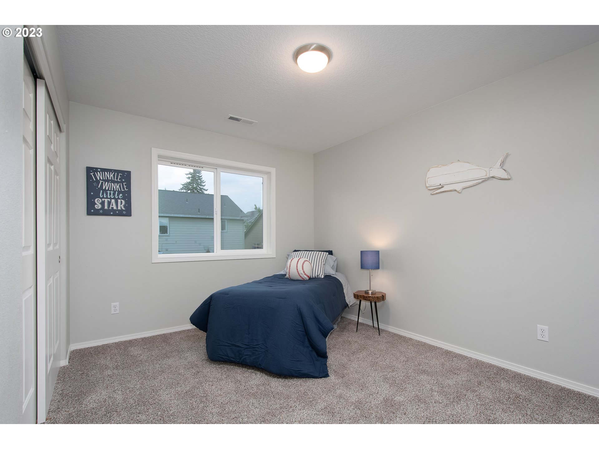 1830 North 8th Way Ridgefield, WA 98642 - Photo 32 of 44 a bedroom with a bed and a window