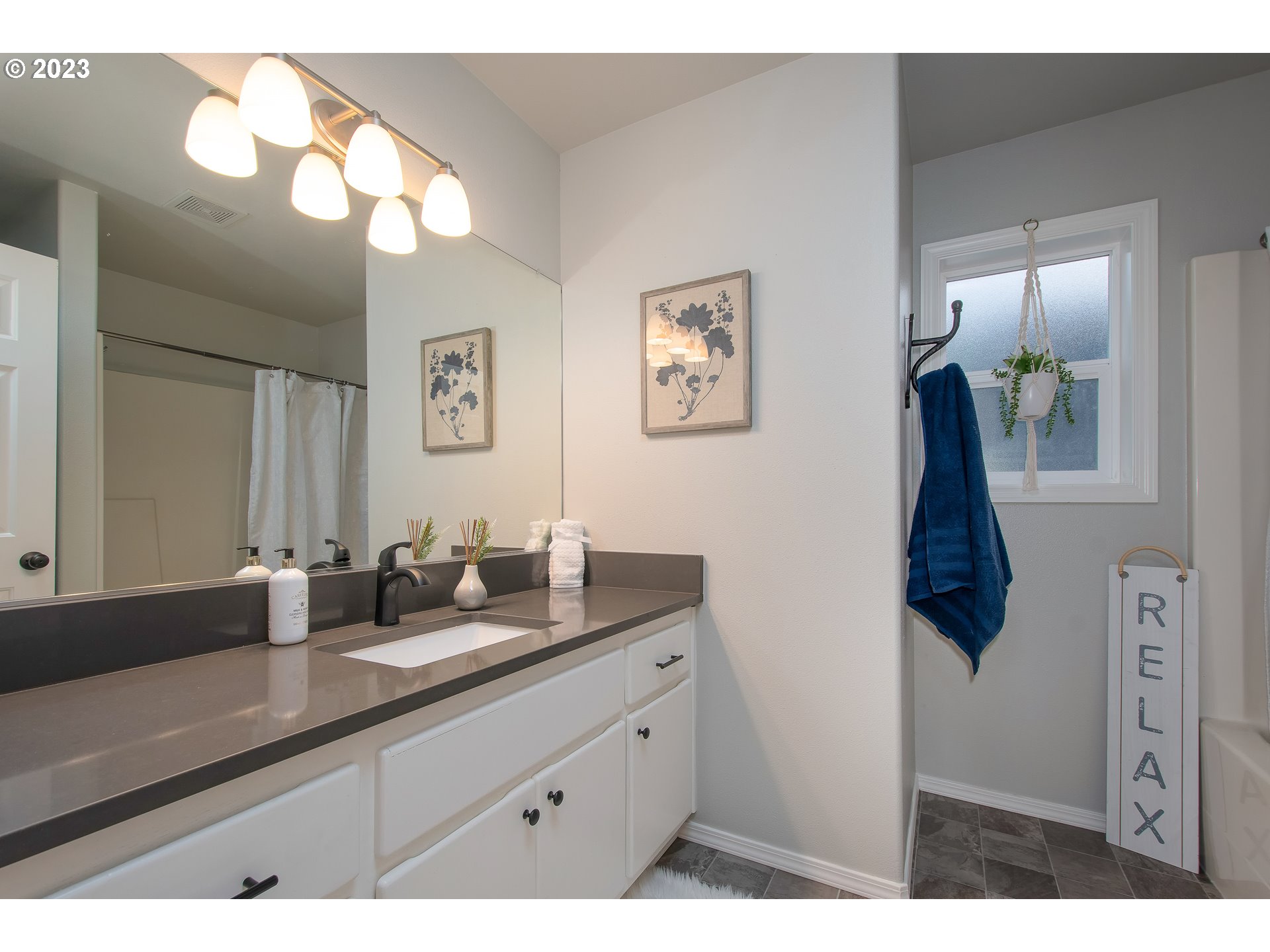 1830 North 8th Way Ridgefield, WA 98642 - Photo 33 of 44 a bathroom with a sink and mirror