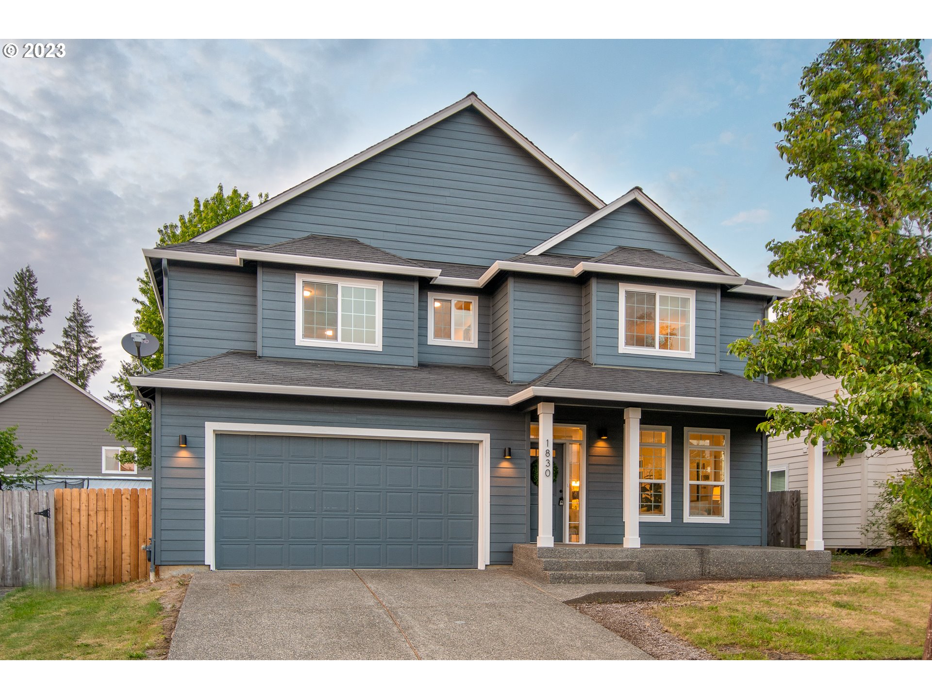 1830 North 8th Way Ridgefield, WA 98642 - Photo 41 of 44 a front view of a house with a garden and garage
