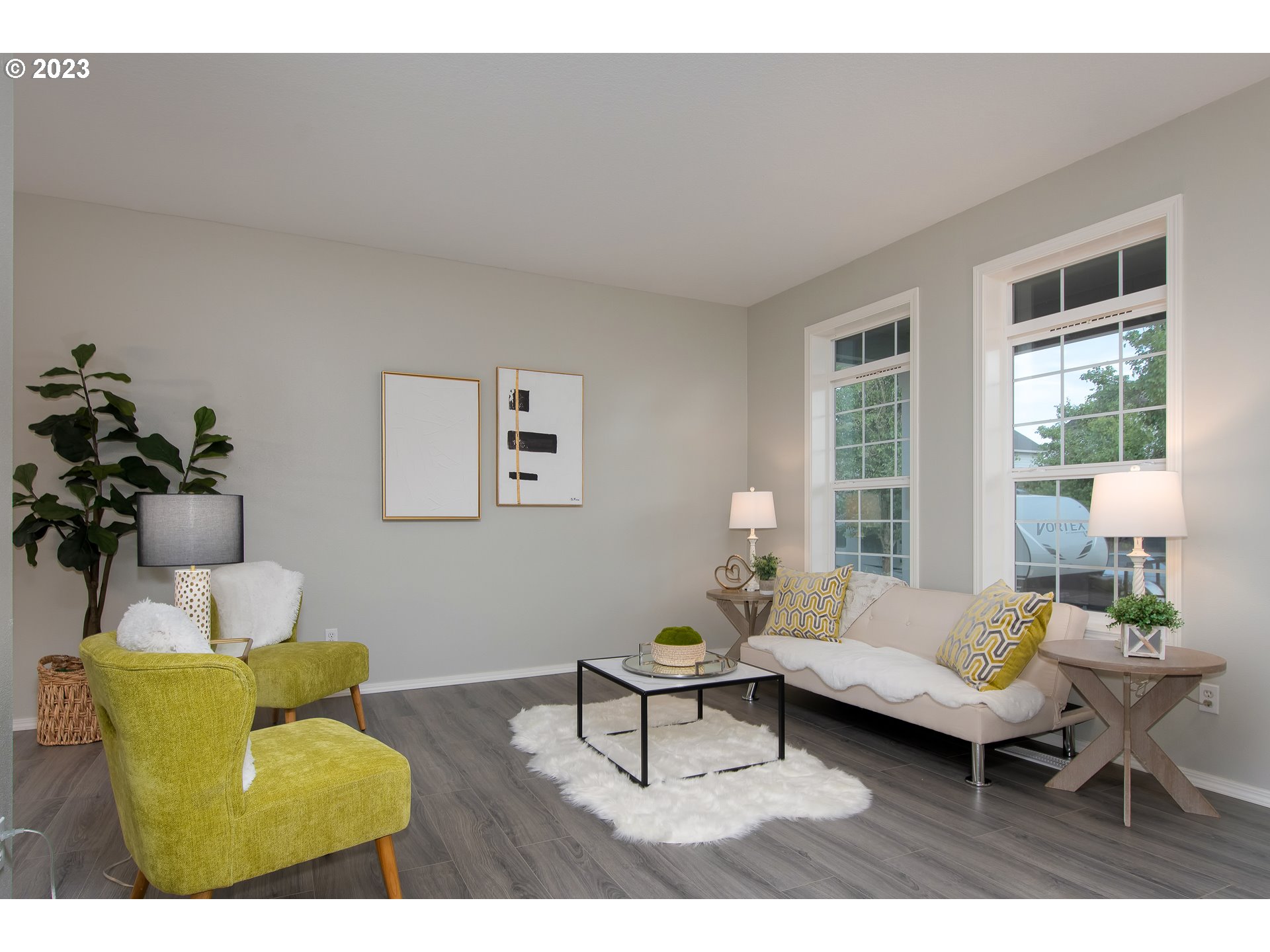 1830 North 8th Way Ridgefield, WA 98642 - Photo 5 of 44 a living room with furniture and a potted plant