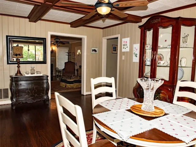 a kitchen with a table and chairs