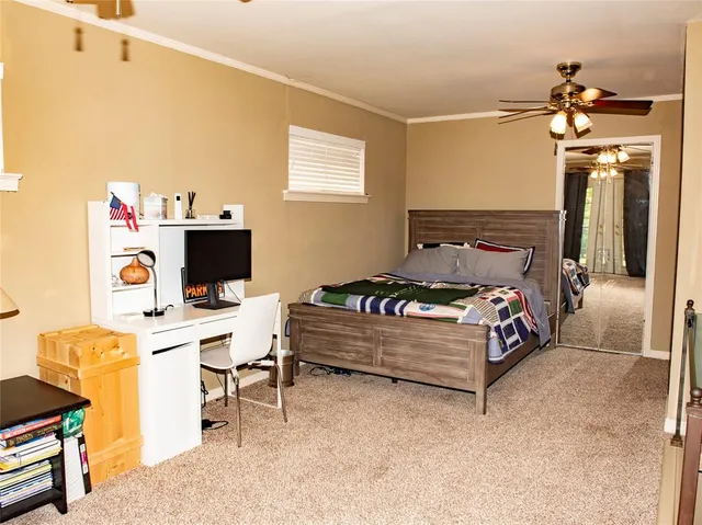 a bedroom with a bed and a table