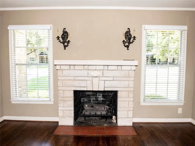 a living room with a fireplace and a window