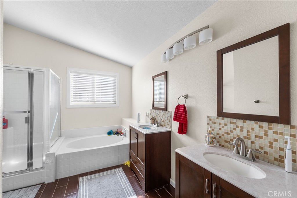 36624 Roosevelt Drive Palmdale, CA 93552 - Photo 5 of 12 a bathroom with a tub sink and mirror
