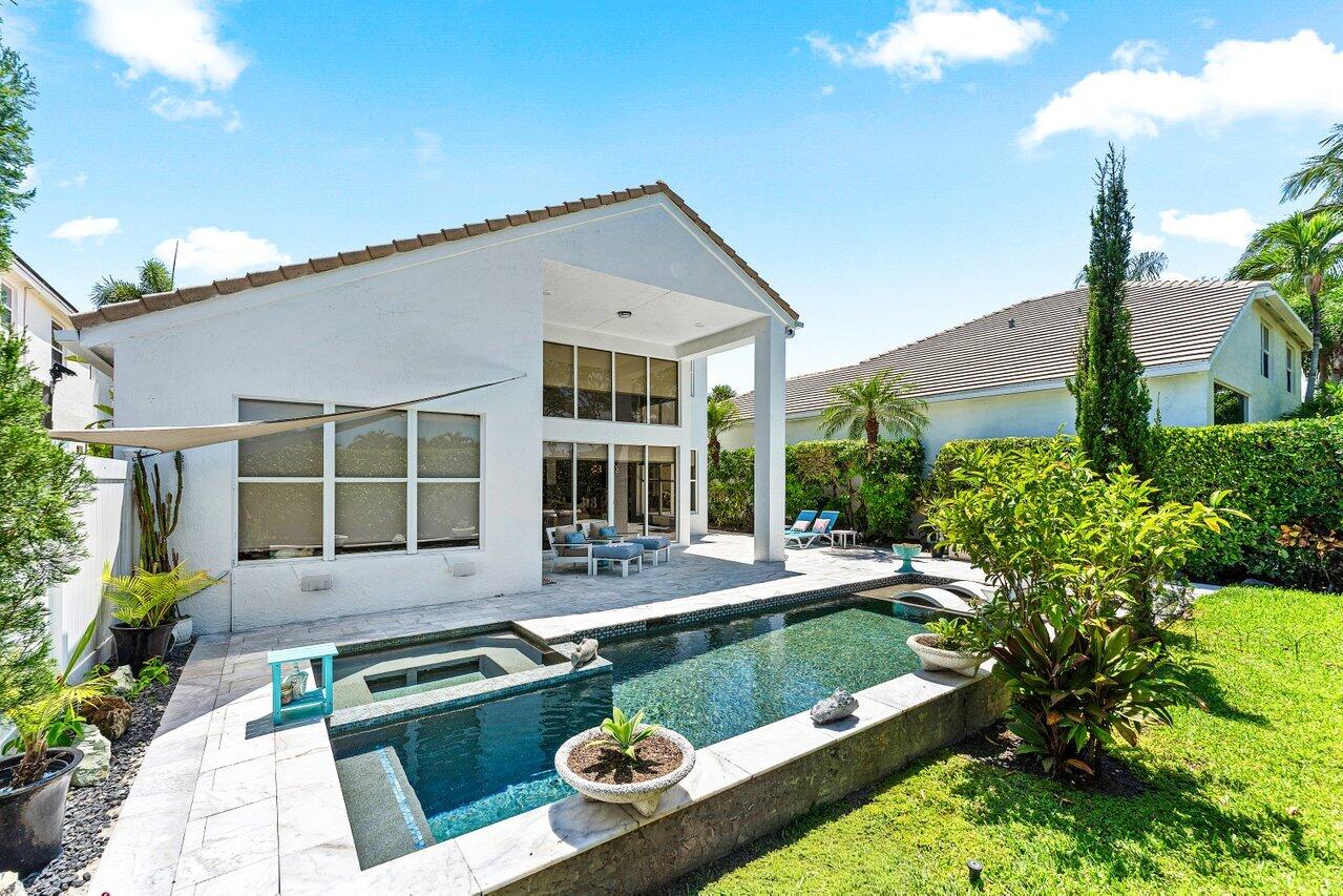 3395 Northwest 53rd Circle Boca Raton, FL 33496 - Photo 22 of 64 a house view with a garden space