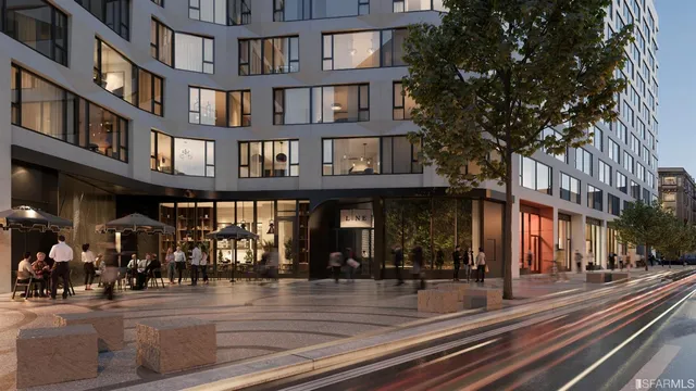 a view of a building and a people on a street