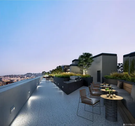 a terrace with outdoor seating and city view