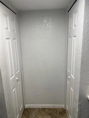 a bedroom with a bed and a mirror