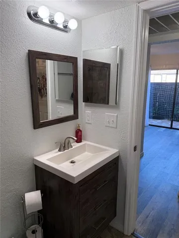 a view of a dining table and chairs in the patio