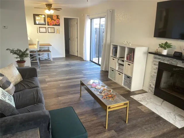 a living room with furniture and a fireplace