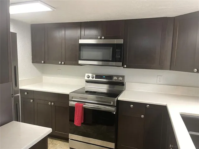 a kitchen with a stove and a microwave