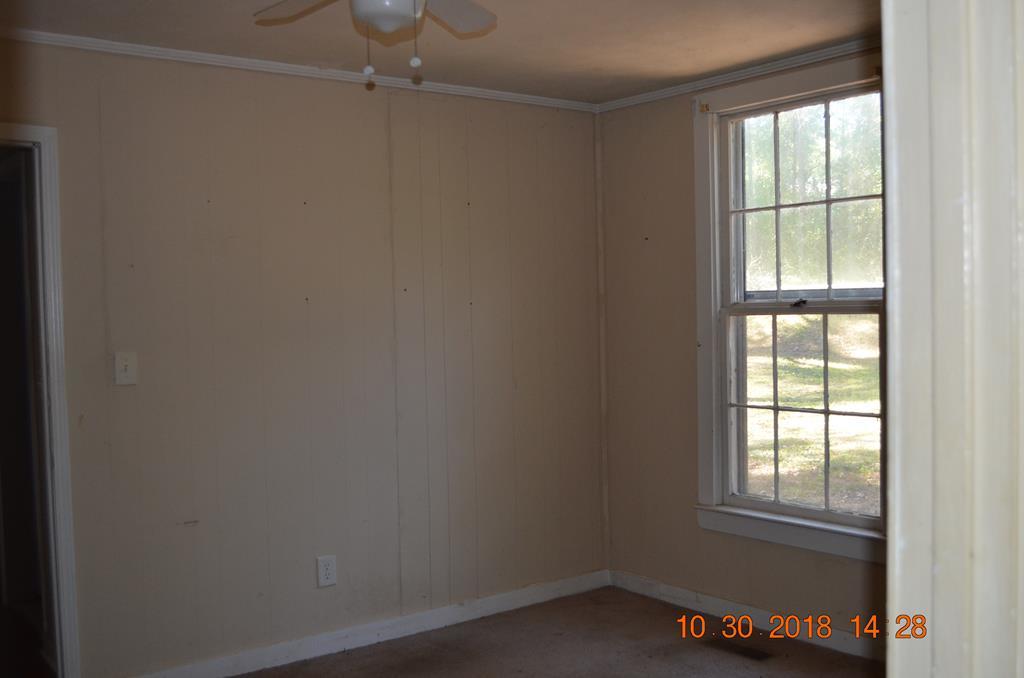275 Jackson Lindsey Road Forsyth, GA 31029 - Photo 2 of 16 an empty room with a window