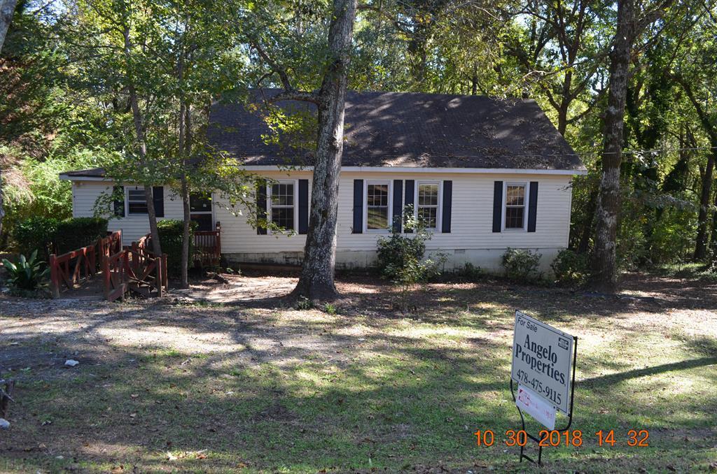 275 Jackson Lindsey Road Forsyth, GA 31029 - Photo 15 of 16 a backyard of a house with yard and outdoor seating