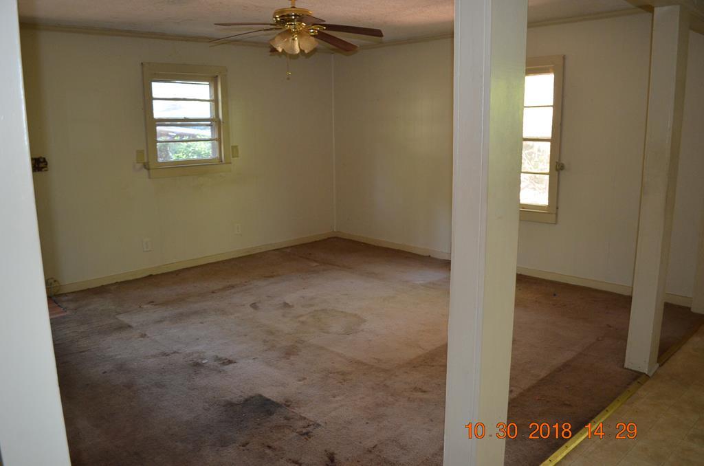 275 Jackson Lindsey Road Forsyth, GA 31029 - Photo 4 of 16 an empty room with windows