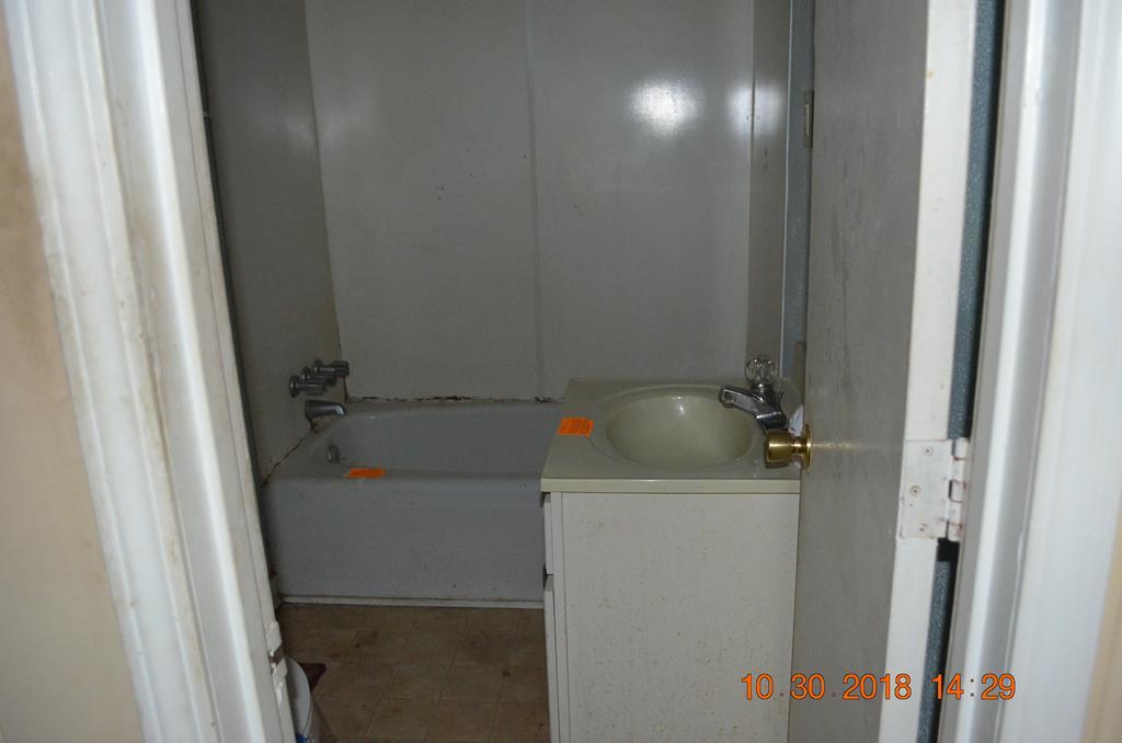 275 Jackson Lindsey Road Forsyth, GA 31029 - Photo 5 of 16 a bathroom with a sink and mirror
