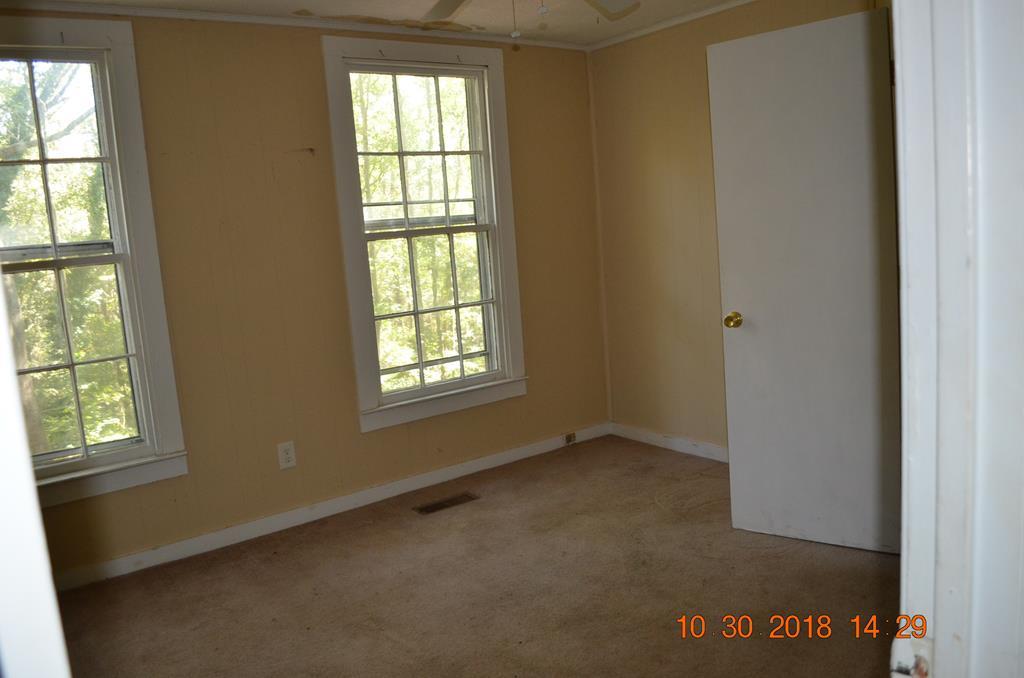 275 Jackson Lindsey Road Forsyth, GA 31029 - Photo 6 of 16 an empty room with windows