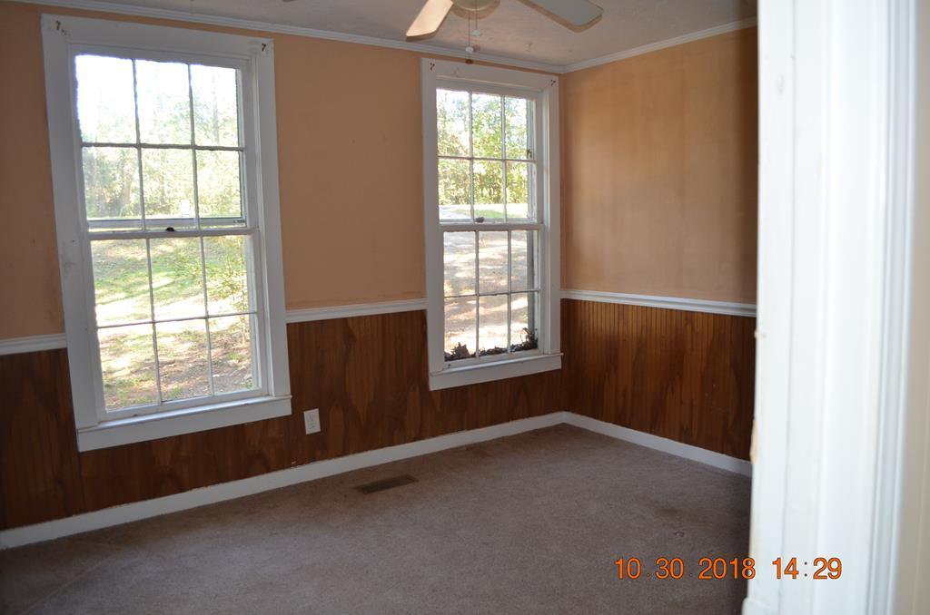 275 Jackson Lindsey Road Forsyth, GA 31029 - Photo 7 of 16 an empty room with a window