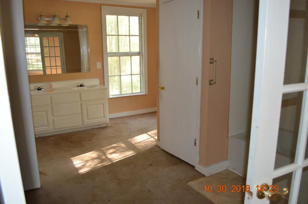 275 Jackson Lindsey Road Forsyth, GA 31029 - Photo 9 of 16 a view of an empty room with a window