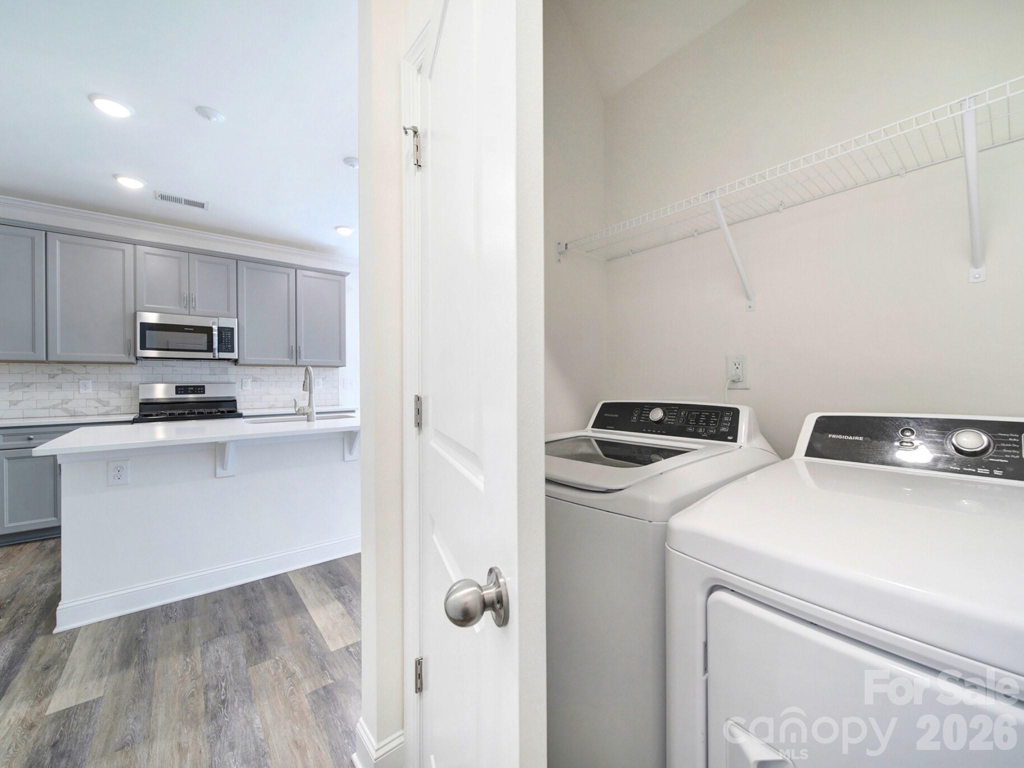 4003 Rothwood Lane Harrisburg, NC 28075 - Photo 16 of 30 a kitchen with appliances a sink and cabinets