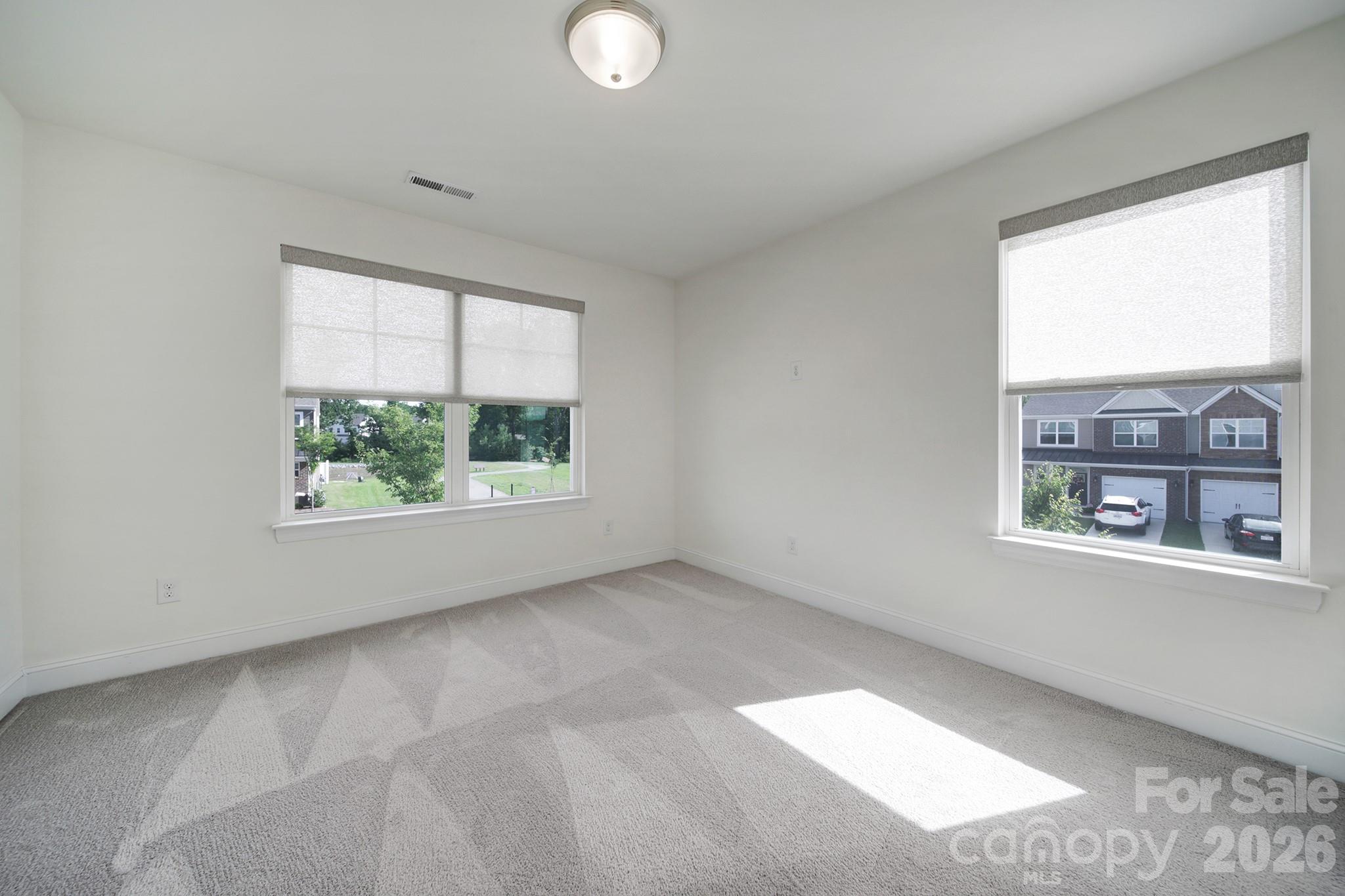 4003 Rothwood Lane Harrisburg, NC 28075 - Photo 20 of 30 an empty room with windows