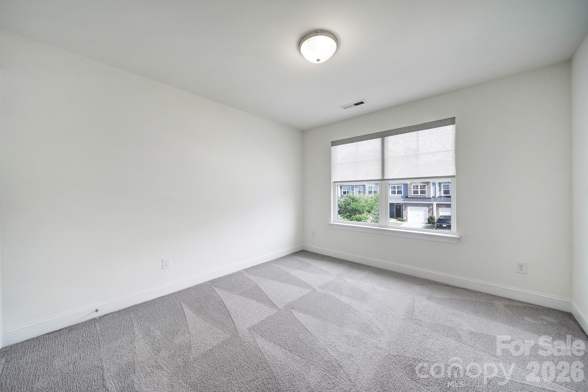 4003 Rothwood Lane Harrisburg, NC 28075 - Photo 22 of 30 an empty room with a window
