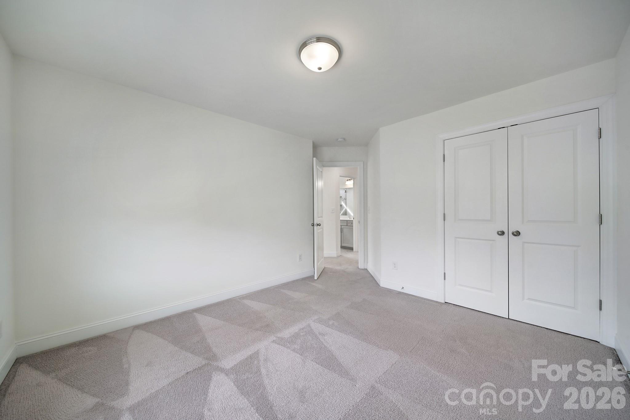 4003 Rothwood Lane Harrisburg, NC 28075 - Photo 23 of 30 a view of an empty room and closet area