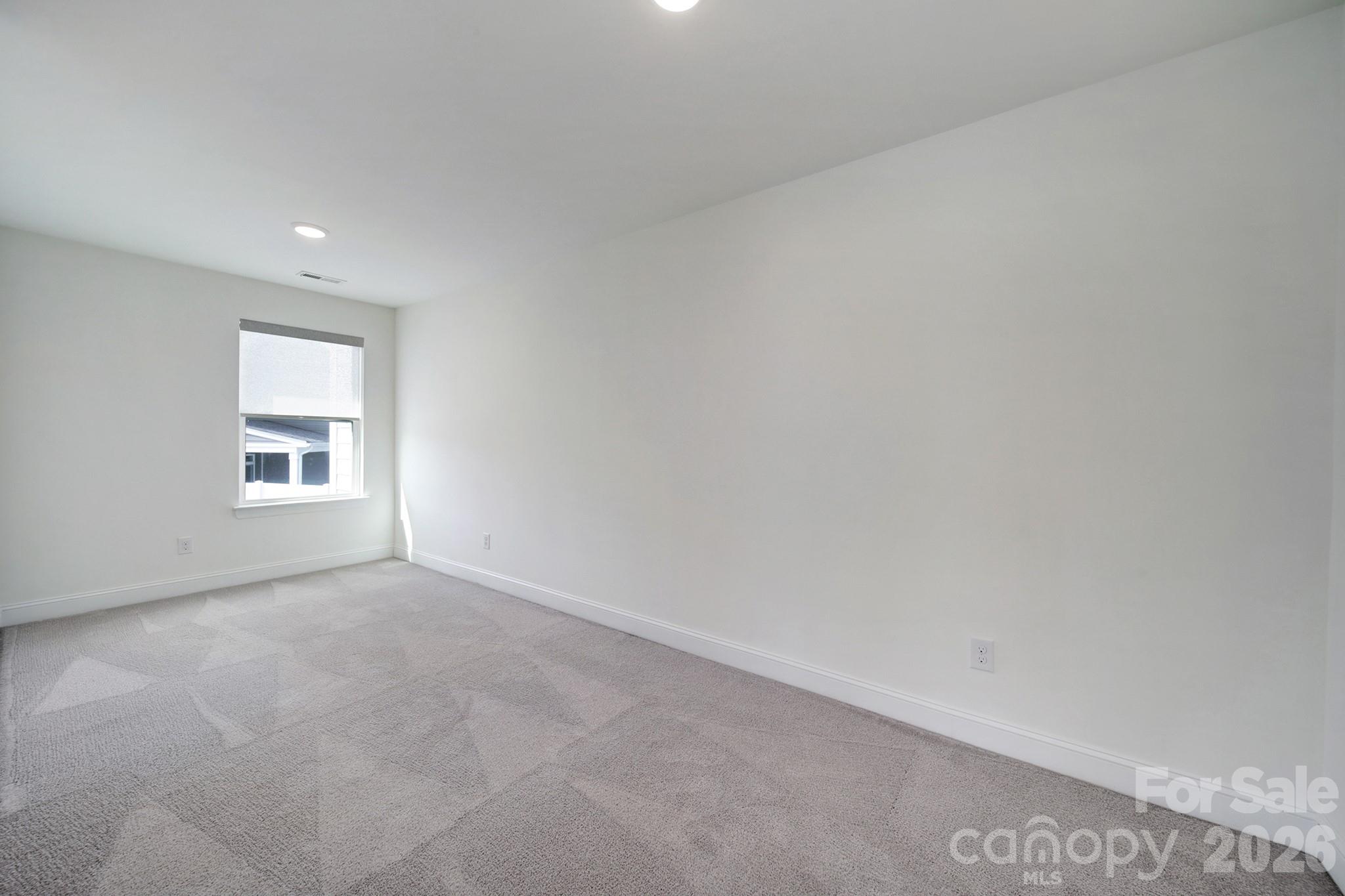 4003 Rothwood Lane Harrisburg, NC 28075 - Photo 24 of 30 an empty room with a window