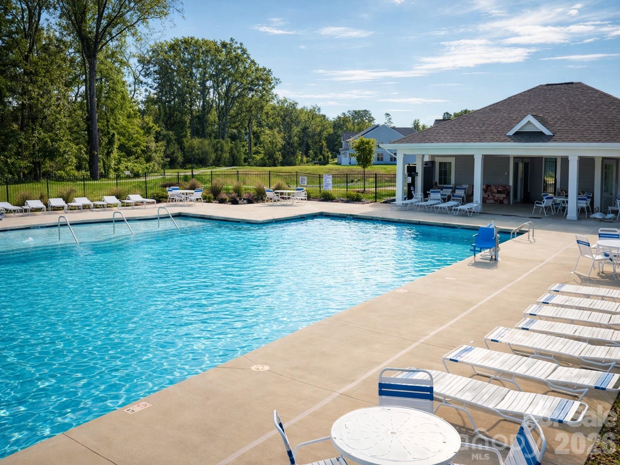 4003 Rothwood Lane Harrisburg, NC 28075 - Photo 29 of 30 a view of a swimming pool with lounge chairs